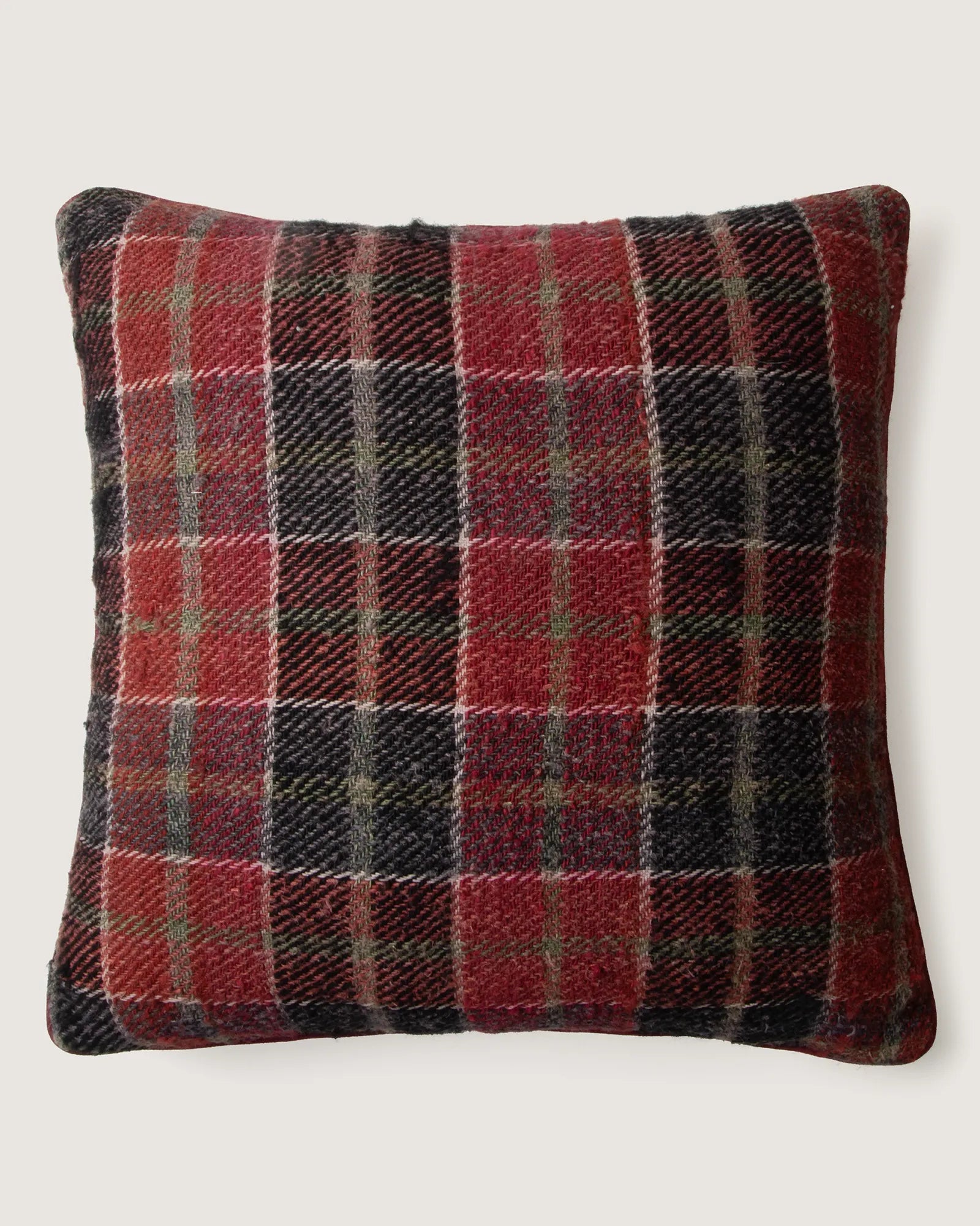 Reversible throw cushion crafted from vintage Eastern European plaid cotton and a coarse antique French grain sack hemp hemp fabric.